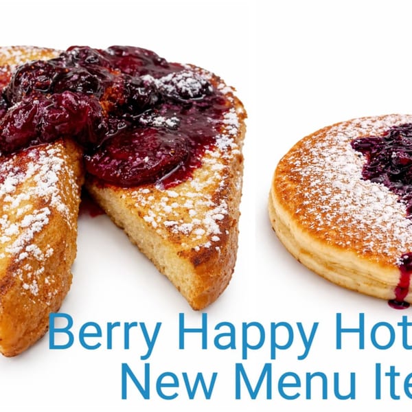 French toast and a pancake, both topped with berry compote and powdered sugar.